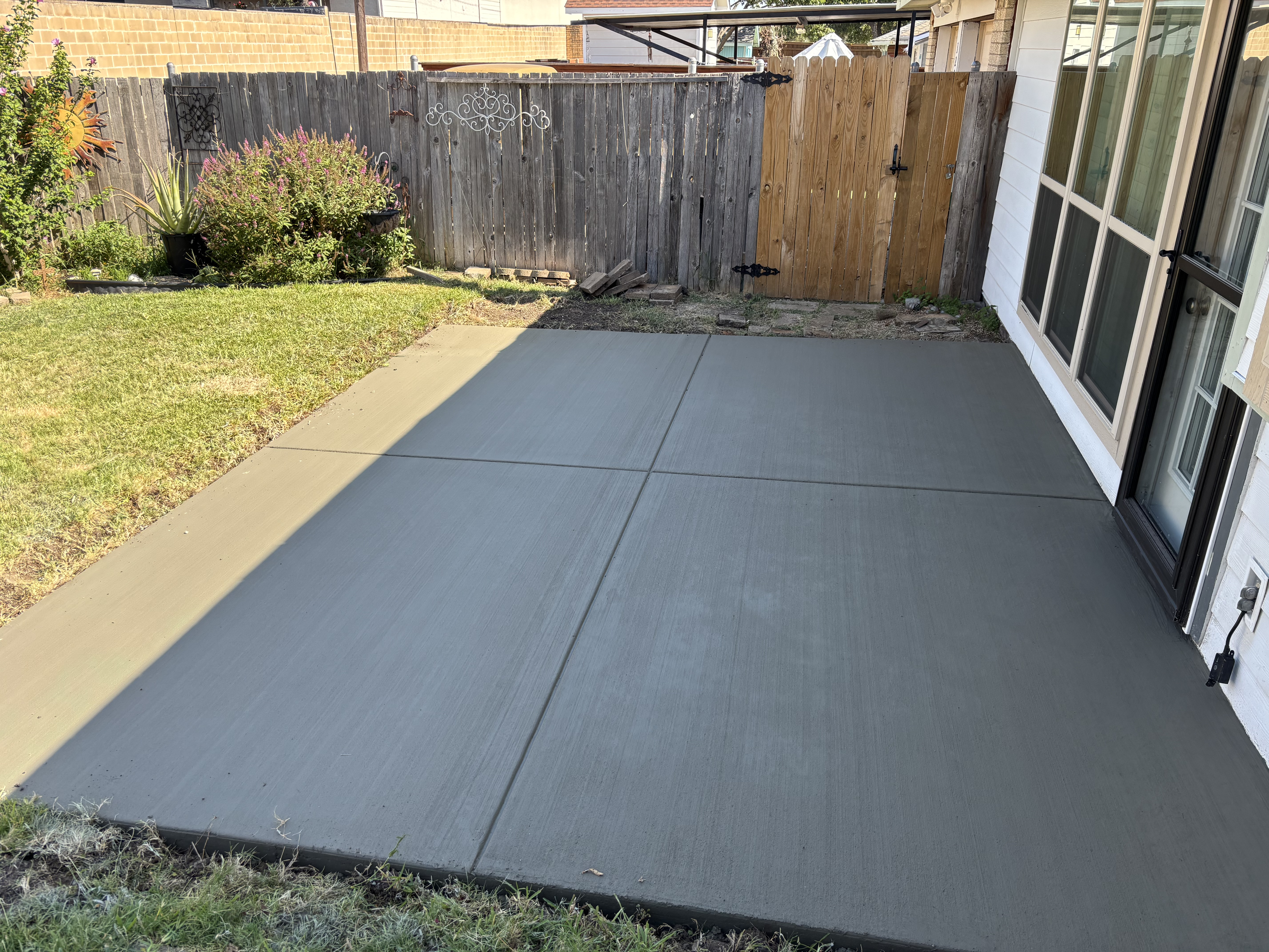 Smooth finished backyard concrete patio